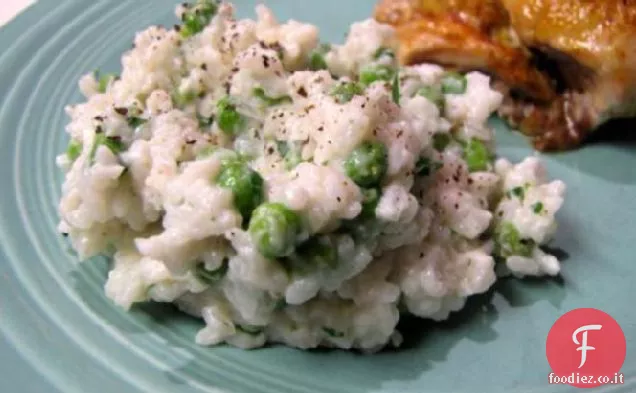 Riso cremoso con piselli ed erbe aromatiche