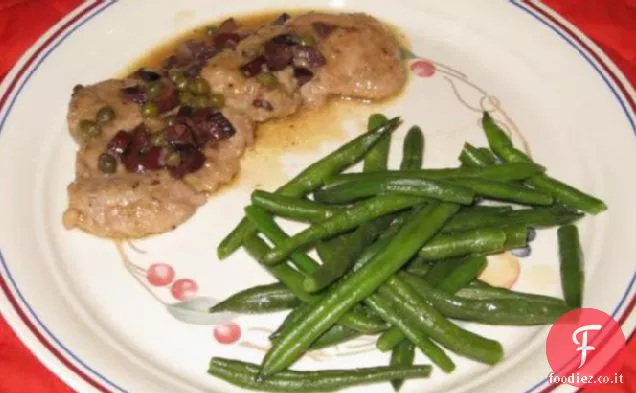 Medaglioni di maiale con salsa di capperi d'oliva