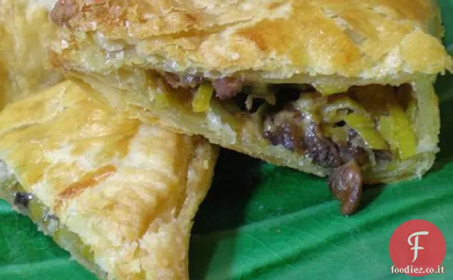Triangoli di pasta sfoglia di porro ai funghi di Iv