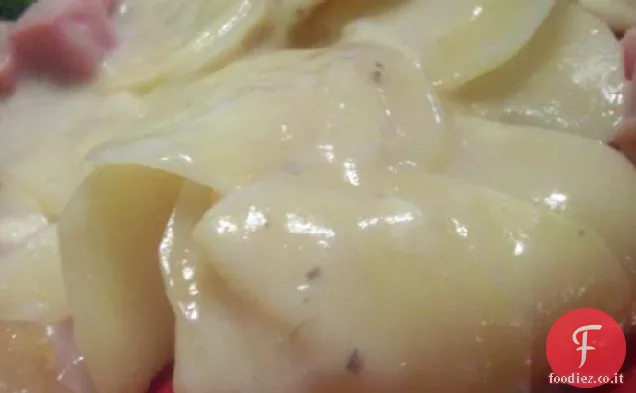 Pentola di coccio Patate smerlate e prosciutto