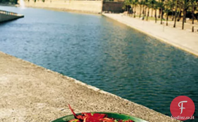 Stufato di aragosta con pomodori e peperoni