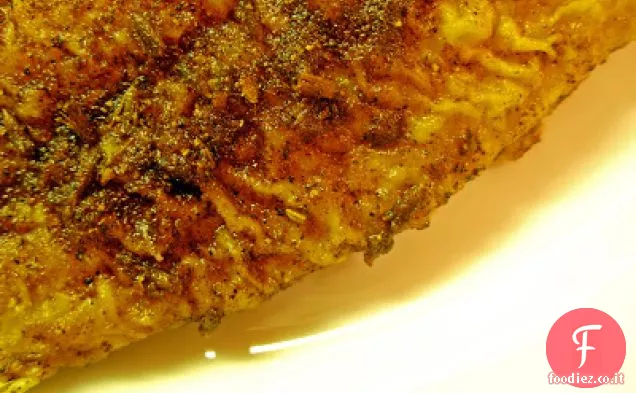 Pesce azzurro annerito e funghi bruciati