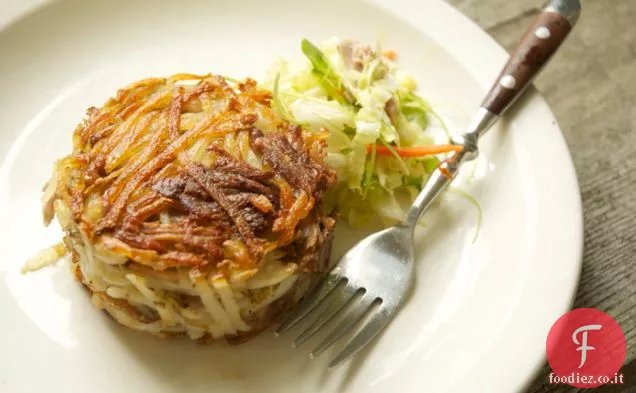 Torte di Confit di patate e maiale con cavolo Napa appassito e crescione