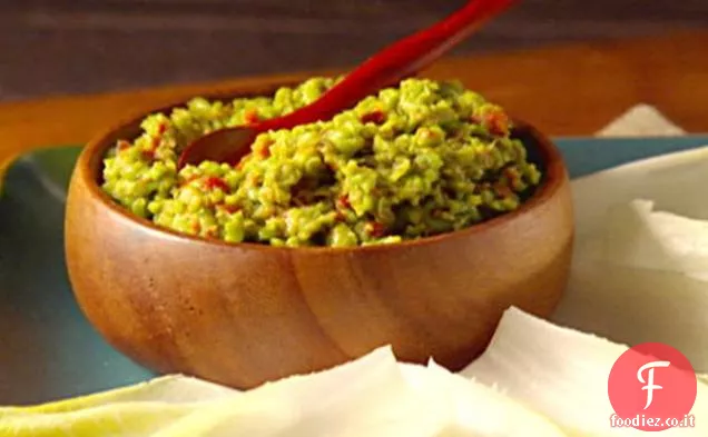 Pomodori secchi e piselli su lance di indivia