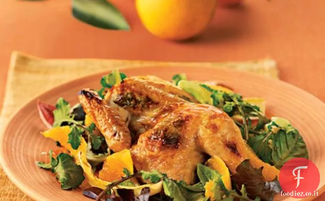 Galline corniche alla griglia con limone, arancia e basilico