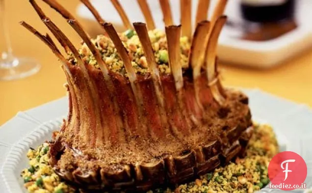 Corona di agnello Rack con erba verde Couscous