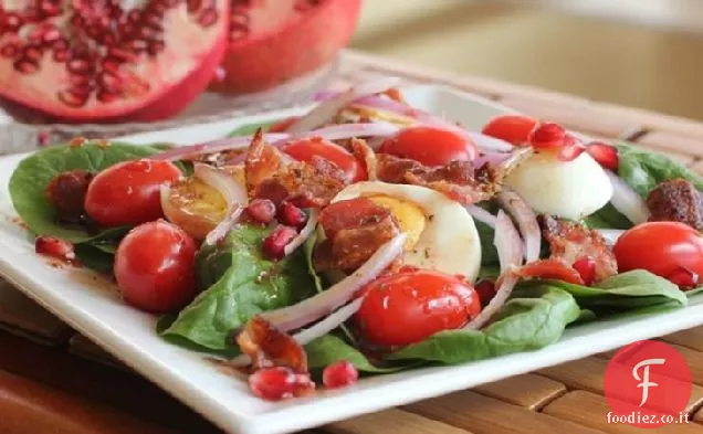 Insalata di spinaci con salsa calda di insalata di melograno