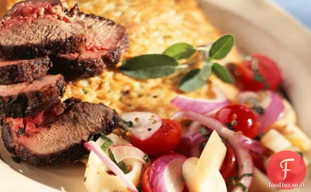 Patrick Sage-y Lombo di agnello in crosta con pancake di capelli d'angelo e cuori spezzati di insalata di pomodori di palma