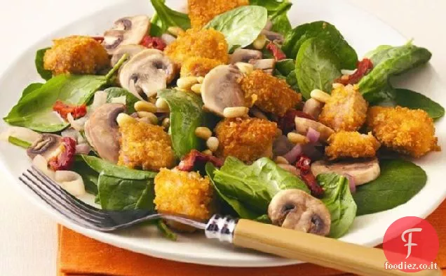 Pollo all'aglio su spinaci Baby con pinoli tostati