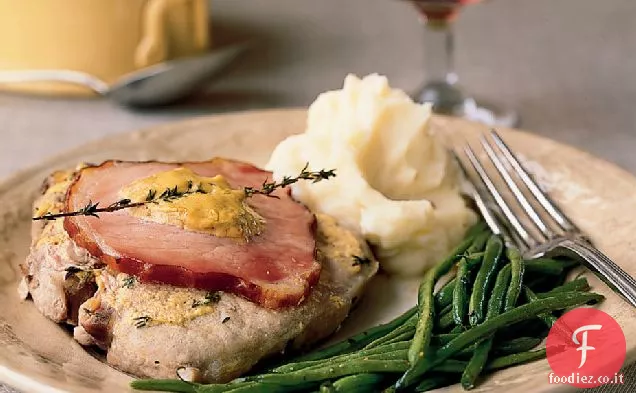 Braciole di maiale con senape e pancetta canadese