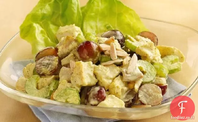 Pollo al curry e insalata di uva