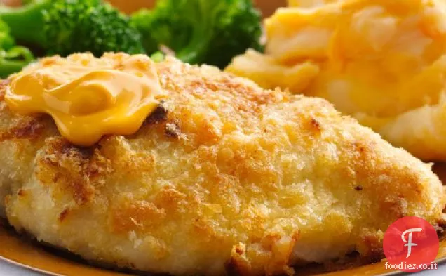 Pollo immerso in patate fritte al forno