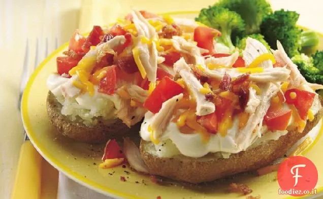 Patate condite con pollo e pomodoro