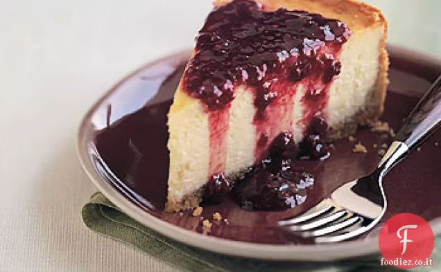 Cheesecake ai fiori d'arancio con salsa di lamponi e melograno