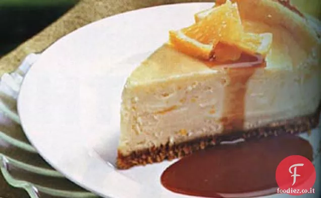 Cheesecake all'arancia con salsa al caramello e arancia