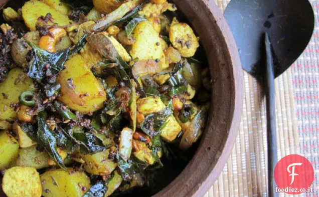 Pollo soffriggere con patate, anacardi e foglie di curry