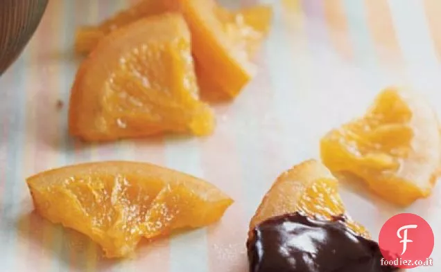Fette di arancia candita con salsa di immersione Ganache