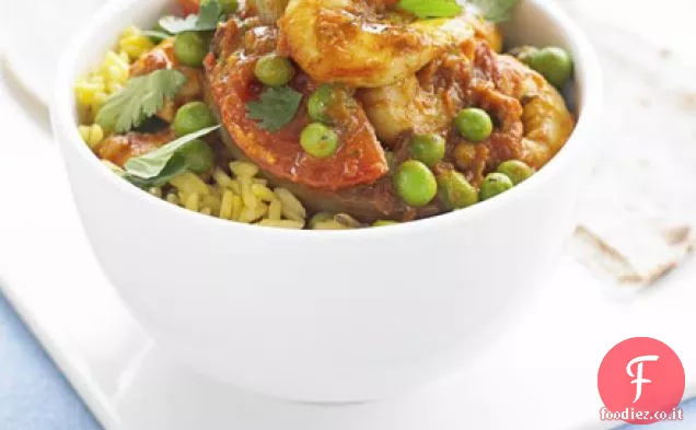 Curry di gamberi, piselli e pomodori