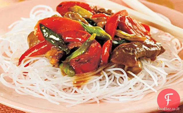 Carne di maiale saltata in padella con salsa all'arancia