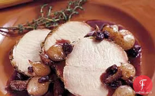 Lonza di maiale in salamoia con cipolla, uva passa e composta di aglio