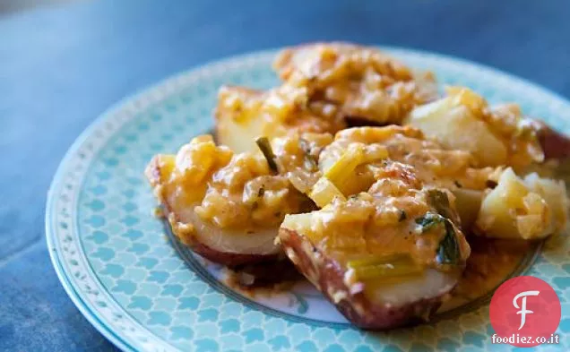 Patate cremose con formaggio e pomodori