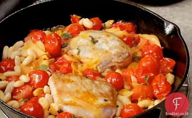Controfiletto di maiale brasato con pomodori, fagioli bianchi e salvia