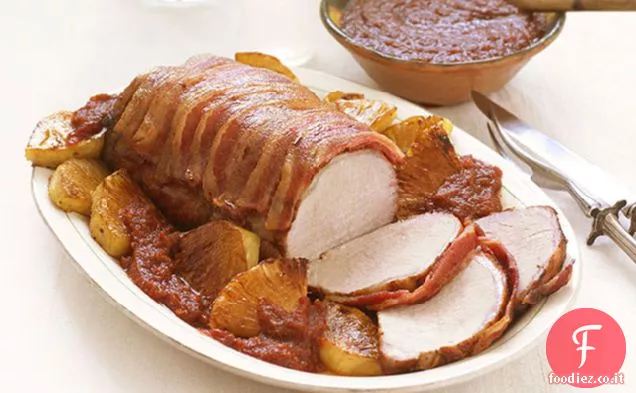 Lombo di maiale avvolto in pancetta con talpa fruttato