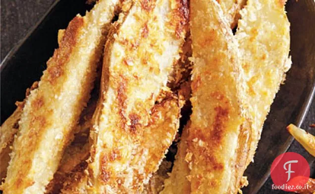 Spicchi di patate spalmati di parmigiano