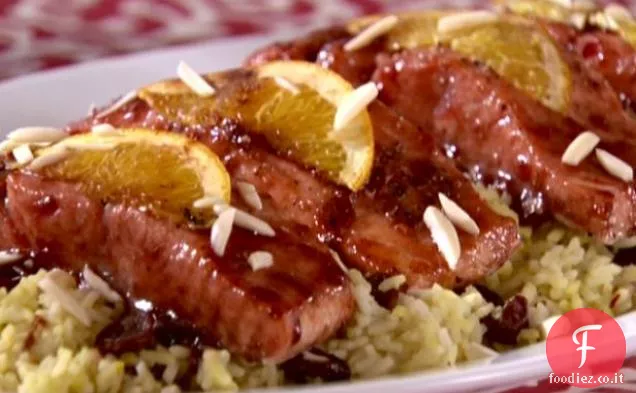 Salmone glassato con ciliegia secca Riso allo zafferano