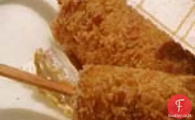Frittelle di banana su un bastone