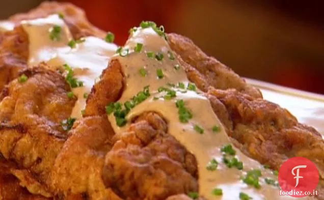 Bistecca di pollo fritto con sugo