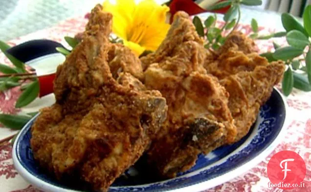 Signora e figli fritto braciole di maiale