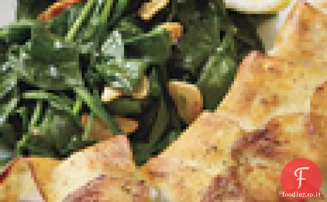 Halibut avvolto in patate con spinaci saltati