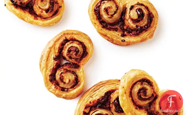 Palmiers di pomodoro essiccato al sole