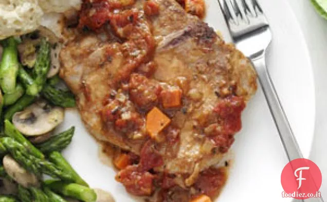 Braciole di maiale italiane condite con pomodoro