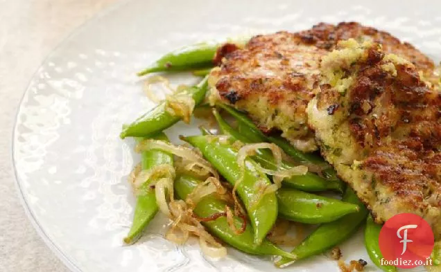 Cosce di pollo con briciole di aglio e piselli a scatto