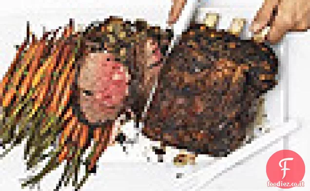 Arrosto di costine in piedi, ripieno di spinaci e porcini, sugo di whisky irlandese e crema di rafano