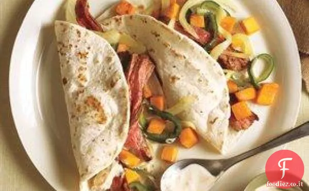 Fajitas di bistecca con patate dolci e Poblano