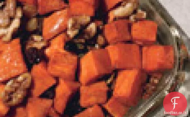 Ignami di granato con sciroppo d'acero, noci e uvetta brandita
