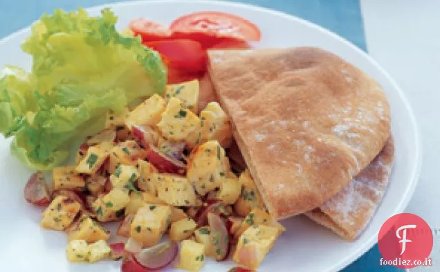 Insalata di pollo al curry alla griglia e pita