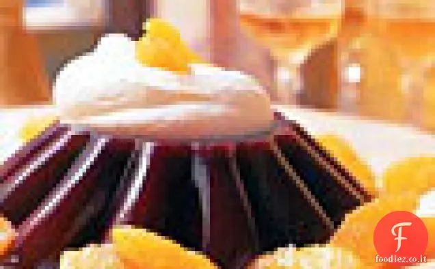 Gelatina di arancia rossa con panna montata brandita