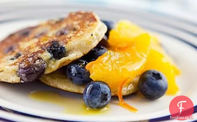 Frittelle di mirtilli e cocco con arance sciroppose