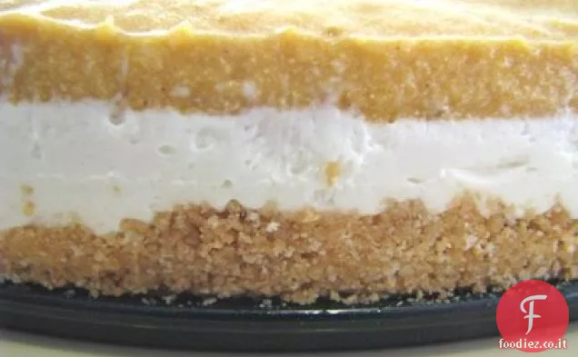 Cheesecake a strati di zucca con crosta di biscotti allo zenzero e limone