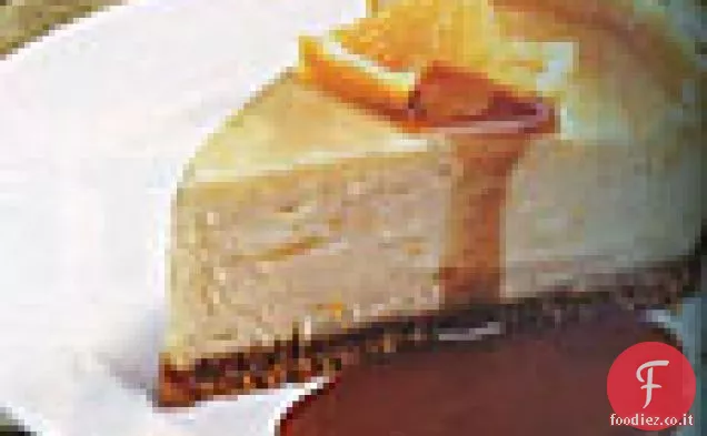 Cheesecake all'arancia con salsa al caramello e arancia