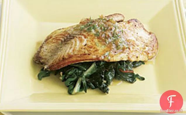 Tilapia saltata su bietola svizzera con burro di dragoncello