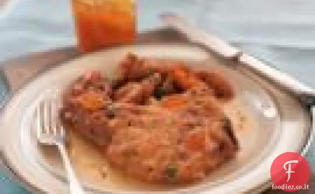 Braciole di maiale imbastite di pesca e Bourbon