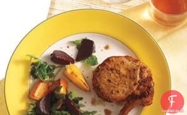 Braciole di maiale con barbabietole arrostite e arance