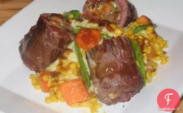 Agnello arrosto provenzale farcito con fichi, formaggio di capra e noci