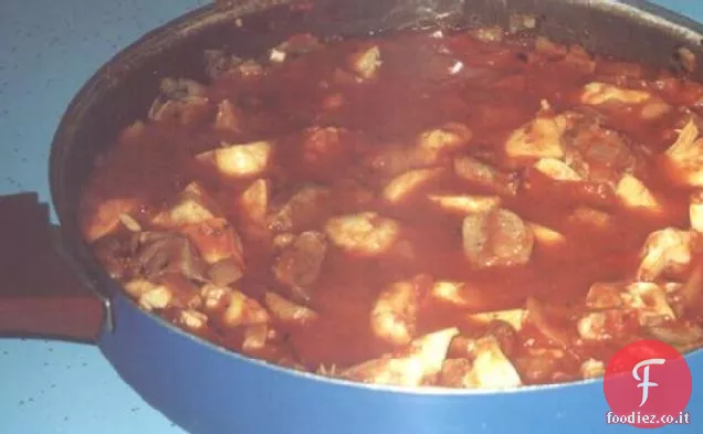 Stufato di agnello, carciofo e pomodoro
